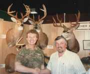 Chatting with Chuck Adams while
displaying one of my archery bucks
(top left) mounted by Ralph Scherder
of Scherder's Taxidermy